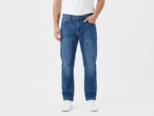 DISTRICT 99 Core Blue Straight Jeans, front model view showing the straight-leg silhouette and core blue wash.